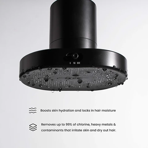 Image 1 - A black showerhead with droplets of water on its surface, accompanied by text stating that it boosts skin hydration and locks in hair moisture, and removes up to 99% of chlorine, heavy metals, and contaminants that irritate skin and dry out hair.
Image 2 - A person is showering with their eyes closed and head tilted back, and on the left side, there are icons and descriptions for lifetime warranty, triple filtration technology, rotating head with adjustable angle, three spray settings for perfect pressure, and fits 99% of showers.
Image 3 - A black shower filter is displayed inside a white box with a logo that reads Qure Shower Filter, and a separate black component is positioned next to it on a white tiled surface.
Image 4 - Image of a triple filtration system showing a water filter on the left and a cross-section of the filter on the right, with labeled layers: FOF Descaling, KDF-55 Layer, and Carbon Fiber Layer; the top text reads Triple Filtration System, and there are bullet points stating removes up to 99% of chlorine & contaminants, boosts skin hydration for a smoother, softer appearance, protects hair from damage, helping it stay stronger, shinier, and reduces clogged pores that can lead to KP flare-ups.
Image 5 - A black, oval-shaped product with perforations on its surface is shown partially submerged in water, with tiled walls in the background and text reading Three Months of Skin-Safe and Purified Water below it.