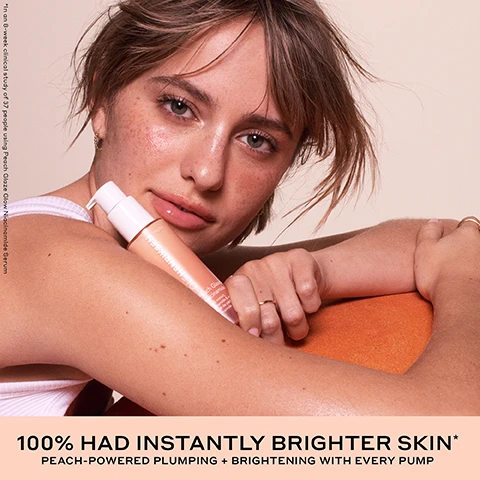 Image 1 - A young woman with dewy skin and light brown hair holds a peach-colored bottle of serum, with visible text reading In an 8-week clinical study of 37 people using Peach Glaze Glow Niacinamide Serum, PEACH GLAZE GLOW Niacinamide Serum, 100% HAD INSTANTLY BRIGHTER SKIN*, PEACH-POWERED PLUMPING + BRIGHTENING WITH EVERY PUMP. Image 2 - A split image shows a womans face before and after an 8-week period, with the left side showing some redness and texture, and the right side showing smoother, clearer skin in highlighted areas; the visible text reads Before, 8 Weeks, 96% SAW A NOTICEABLE IMPROVEMENT TO THEIR SKIN*, *In an 8-week clinical study on 37 people. Image 3 - A split image shows a persons face before and after treatment, with the left side labeled BEFORE showing more visible pores and a blemish, and the right side labeled 4 WEEKS showing improved skin texture with less visible pores, and text below reads IMPROVES THE APPEARANCE OF PORES *In an 8-week clinical study on 37 people. Image 4 - A split image shows a womans face before and after treatment, with the left side labeled BEFORE showing duller skin and the right side labeled INSTANT showing brighter, plumper skin, highlighting improvements with dotted circles on the forehead and cheek, with additional text that reads INSTANTLY BRIGHTENS + PLUMPS SKIN WITH HYDRATION* *In an 8-week clinical study on 37 people. Image 5 - A peach-toned Ole Henriksen pump bottle with a drop of serum emerging from its nozzle is tilted against two peach halves, displaying text that reads OLEHENRIKSEN TRUTH Peach Glaze Niacinamide Serum, Peach extract, niacinamide & vitamin E, Extrait de pêche, niacinamide et vitamine E, along with claims 94% saw instantly plumper-looking skin*, 97% had instantly smaller-looking pores*, 100% had instantly brighter skin*, and the footnote *In an 8-week clinical study of 37 people. Image 6 - A peach-colored product swatch on a light background displays the text PEACH-POWERED BRIGHTENING + PLUMPING HYDRATION, with four circular insets showing ingredients: PEACH EXTRACT + JUICE brighten + provide antioxidant-rich hydration; HYALURONIC + POLYGLUTAMIC ACID hydrate + bind moisture; NIACINAMIDE brightens+ reduces the appearance of pores; and ENHANCED VITAMIN C brightens + defends against pollution. Image 7 - Close-up of a pump dispenser bottle extruding a thick, golden, shimmering gel, with the text Cushiony gel, Juicy peach scent, Luminous finish. Image 8 - Three Ole Henriksen peach-themed skincare products, consisting of a lip treatment tube, a facial mist spray, and a niacinamide serum pump bottle, are displayed on a light background with the lip treatment squeezing product onto a peach, and the visible text reads THE JUICY CLINICAL RESULTS YOUR SKIN CRAVES, PEACH GLAZE GLOW NIACINAMIDE SERUM A plush, peach-powered gel serum to clinically brighten+ plump with every pump* *In a 4-week clinical study on 37 people, PEACH GLAZE GLOW MIST An ultra-fine facial mist for brightening + hydration instantly and over time* *In a 4-week clinical study on 38 people, PEACH GLAZE POUT PRESERVE A juicy squeeze of sweet peach for fuller-looking lips in 1 week** **In an 8-week clinical study on 39 people, OLEHENRIKSEN, I LOVE OLEHENRIKSEN, Pout Preserve Peptide Lip Treatment, Net Wt. 0.3 fl. oz. / 9 mL e, OLEHENRIKSEN, TRUTH, Peach Glaze Glow Mist, Peach ferment & vitamin C, Ferment de pêche et vitamine C, 4 fl. oz. / 120 mL e, OLEHENRIKSEN, TRUTH, Peach Glaze Glow Niacinamide Serum, Peach extract, niacinamide & vitamin C, Extrait de pêche, niacinamide et vitamine C, 1 fl. oz. / 30 mL e, and an H on a white sticker on the peach. Image 9 - The image displays three Olehenriksen Truth skincare serum bottles, one peach, one orange, and one smaller orange, each with a matching color swatch behind it on a light peach background, featuring the text BRIGHTEN WITH OLE; the products are OLEHENRIKSEN TRUTH Peach Glaze Glow Niacinamide Serum, also labeled PEACH GLAZE GLOW SERUM, with description Vitamin C, peach extract + niacinamide for brightening + antioxidant-rich hydration, OLEHENRIKSEN TRUTH Banana Bright Vitamin C Serum, also labeled BANANA BRIGHT SERUM, with description 15% vitamin C + 5% PHA to visibly reduce dark spots, and OLEHENRIKSEN TRUTH Truth Serum, also labeled TRUTH SERUM, with description True-C Complex to brighten + condition skin.