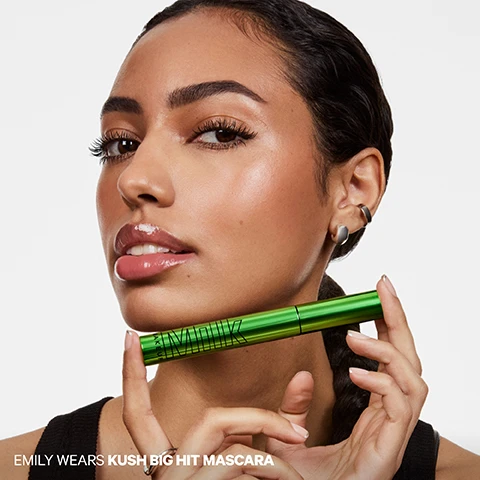 Image 1 - Emily is shown from the chest up with glowing skin and long eyelashes, holding a green mascara tube labeled MILK horizontally near her chin, with the text EMILY WEARS KUSH BIG HIT MASCARA visible in the bottom left corner. Image 2 - A grid of six close-up eye images shows before and after results of KUSH Big Hit Mascara on sparse, straight, and curly lashes, demonstrating increased volume and curl, with text reading BEFORE KUSH Big Hit Mascara, AFTER KUSH Big Hit Mascara, SPARSE LASHES, STRAIGHT LASHES, CURLY LASHES. Image 3 - A bright green Milk Kush Mascara tube with its black fluffy brush extended is shown against a white background, accompanied by text reading: BIG HIT BRUSH, Unique criss-cross bristles catch + coat every lash for max impact, Tapered tip easily defines inner corners + lower lashes, Big fluffy brush delivers full volume without clumps. Image 4 - A close-up of an eye with long, voluminous eyelashes next to text that reads: CLINICALLY PROVEN RESULTS 100% SAID LASHES HAVE HIGH VOLUME AND LOOK LONGER 100% SAID MASCARA IS BUILDABLE 93% SAID LASHES ARE FLAKE-FREE 90% SAID LASHES ARENT WEIGHED DOWN AND LOOK LIFTED *In a consumer perception study of 33 people immediately after using the product. Image 5 - The image displays a wavy black textured background with three white information boxes, titled LASH-CARING INGREDIENTS, the first box highlights LIGHT-AS-AIR VOLUME Cloud Fiber Tech puffs up lashes for weightless volume + lift, the second box describes NOURISHES + STRENGTHENS Hemp seed oil and murumuru seed butter help condition and fortify lashes, and the third box states STAYS CLUMP-FREE Vegan waxes provide creamy, buildable texture that doesnt flake or clump. Image 6 - A bright green Milk Makeup mascara tube stands centered on a silver circular metallic surface, with promotional text that reads MAX OUT THE VOLUME, Light-as-air volume with up to 12-hour wear, No clumping, smudging, flaking or drooping, Conditions + nourishes lashes, Ophthalmologist tested + safe for sensitive eyes, CLEAN. VEGAN. CRUELTY-FREE. Image 7 - A close-up of a persons eye with voluminous mascara on the upper and lower lashes and a well-groomed eyebrow, with the text A BIG HIT OF LIGHT-AS-AIR VOLUME. Image 8 - The image showcases two mascara products: a silver tube labeled KUSH HIGH ROLL MASCARA MILK MAKEUP with a slender wand, and a green tube labeled KUSH MASCARA MILK MAKEUP with an angled wand, accompanied by informational text that states: THE KUSH COLLECTION CLEAN. VEGAN. CRUELTY-FREE. SAFE FOR SENSITIVE EYES. OPHTHAMOLOGIST-TESTED. 1 KUSH HIGH ROLL TUBING MASCARA Lengthen + define up to 24 hours Water-resistant, smudge-proof tubing technology Flexible, tapered brush separates lashes for maximum definition. 2 KUSH BIG HIT VOLUMIZING MASCARA Volumize + lift up to 12 hours No smudging, clumping, flaking or drooping Crisscross bristles coat lashes with weightless volumizing fibers. Image 9 - Close-up of a persons face showing an eye with full eyelashes, a glossy mouth, and an ear with two earrings, with the text FEYI WEARS KUSH BIG HIT MASCARA.